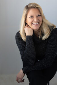 Woman is in a relaxed pose for a high end unique headshot