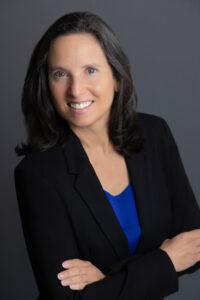 Denver Headshot of a woman in a black jacket