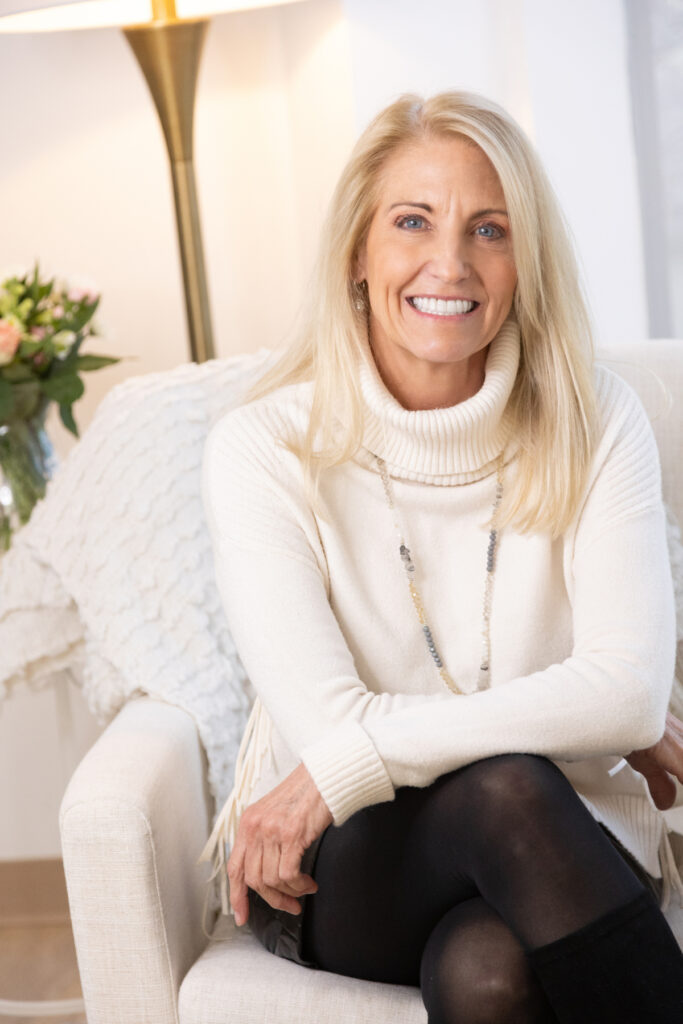 Denver woman smiling confidently during dating photo session with minimal props.