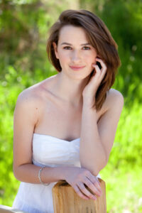 Senior Photo of a girl in a field in Littleton