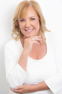 Headshot of a woman in white Littleton Colorado