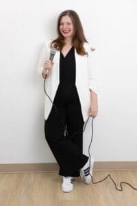 Personal Branding Photo - Woman in stylish outfit holding microphone